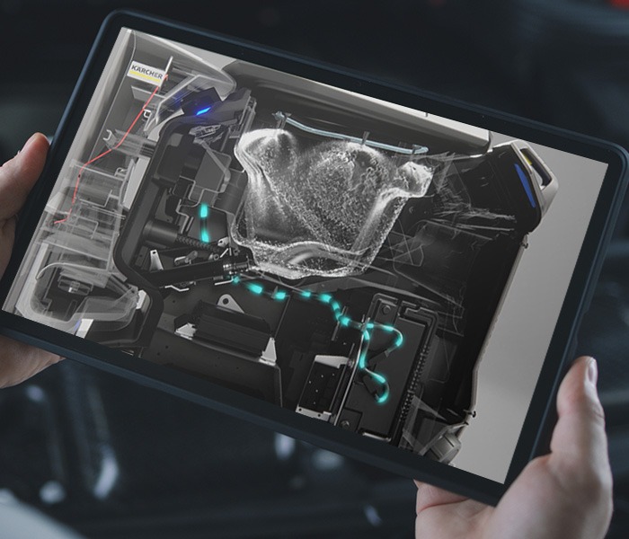 Mann schaut mit einem tablet eine Augmented-Reality Anwendung an um Zusatzinformationen zur Wartung eines Motors zu erhalten